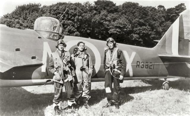 Pictured is R3821 with left to right, Sgt. Don A.W. McFarlane, Observer, Sgt. Peter K. Eames, Wireless operator/airgunner and Pilot Officer Donald M. Wellings, Pilot, in flying kit by R 3821. On 22 October1940, Eames and McFarlane were awarded the D.F.M., Wellings the D.F.C. 